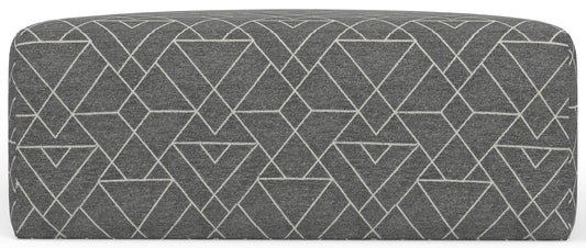 Rectangular upholstered ottoman with dark gray geometric pattern and white line accents