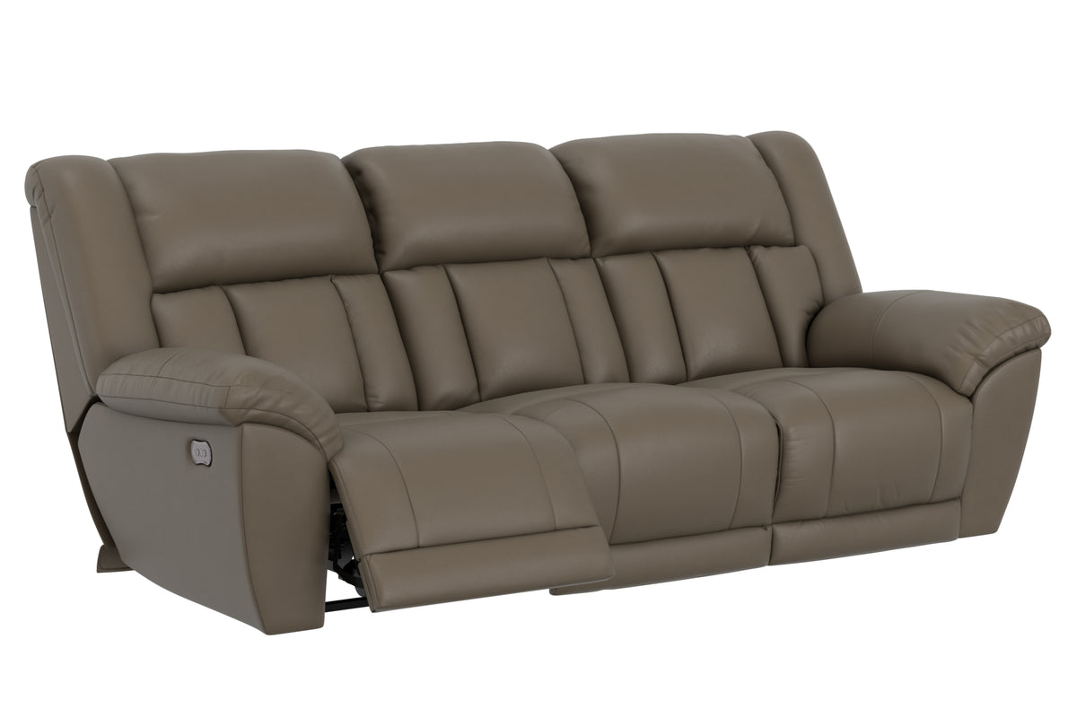 Power reclining sofa with segmented back and extended comfort footrest