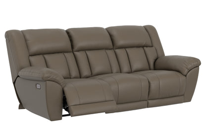 Power reclining sofa with segmented back and extended comfort footrest