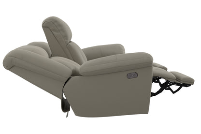 Taupe power reclining sofa with extended footrest and control switch, angled view.