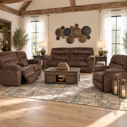 Power loveseat with dark gray-brown fabric upholstery and cushioned arms, in a living room.