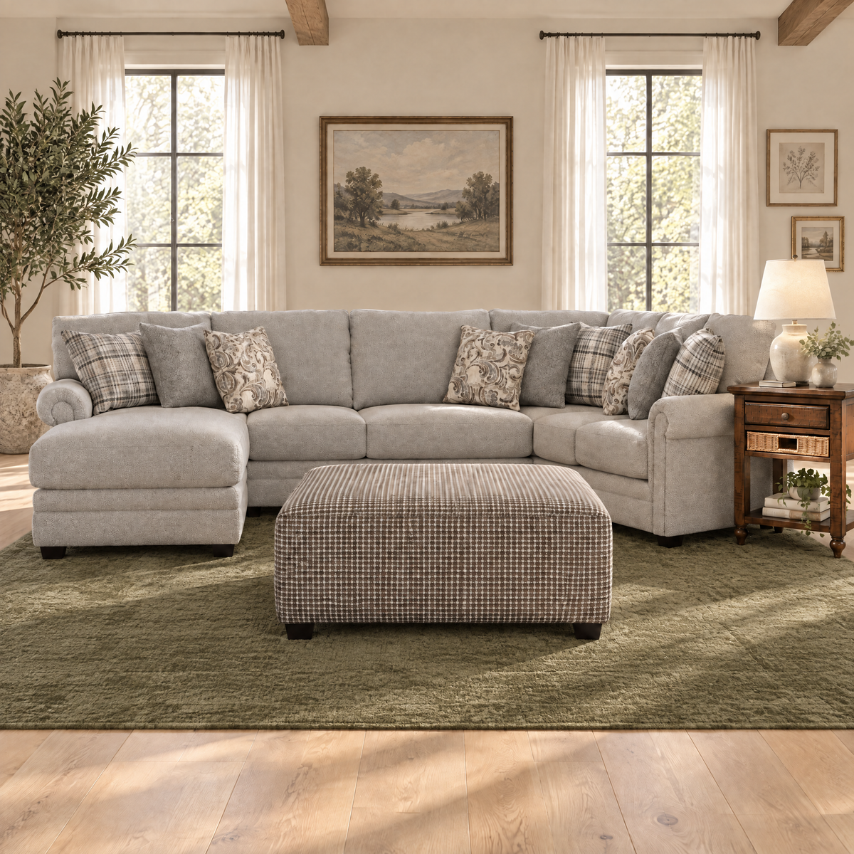 Light gray sectional sofa with patterned pillows, chaise and matching ottoman