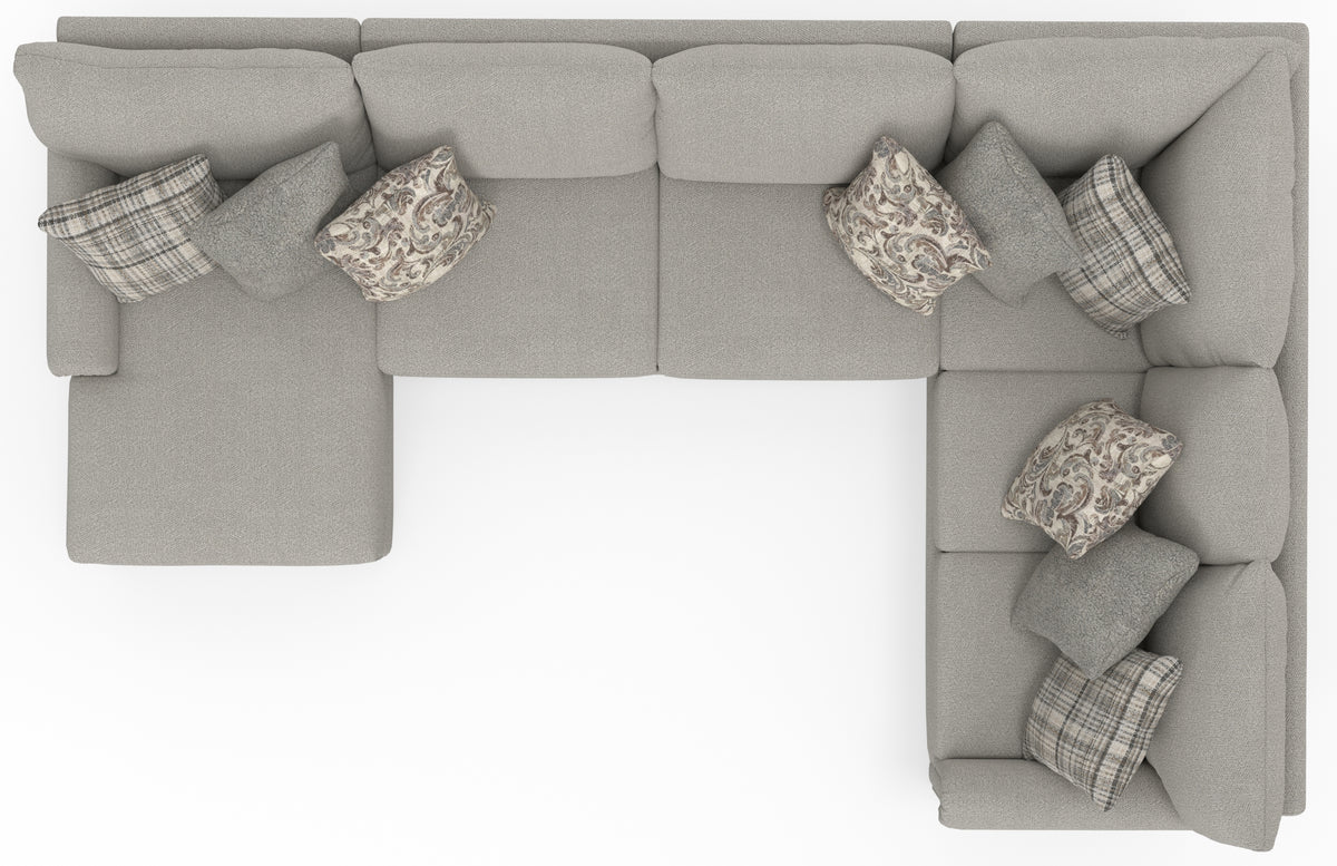 Light gray corner sectional with patterned pillows and ottoman-like seat