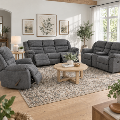 Dark gray reclining sofa with padded arms, channel-tufted back, and plush cushions.
