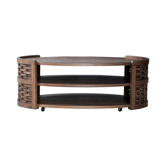 Oval wooden coffee table with woven end panels, two open shelves, and caster wheels