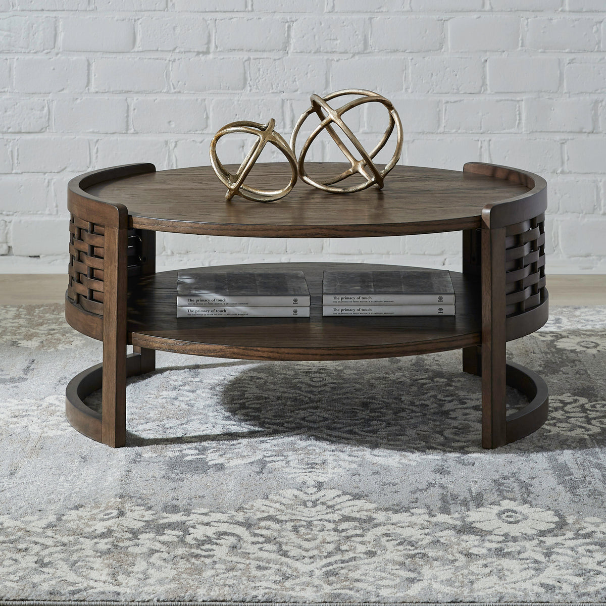 Round coffee table with two shelves, woven side panels, and dark wood finish