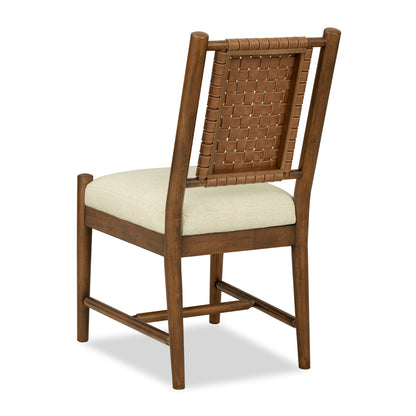 Side chair with woven back panel and cream upholstered seat on dark wood frame