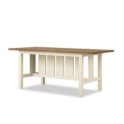 Counter-height trestle table with warm brown top and white trestle legs