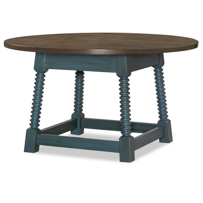 Round pedestal table with dark wood top, blue turned legs, and lower shelf