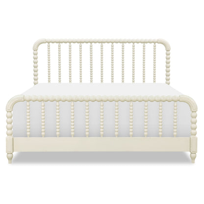 Cream panel bed front with arched headboard, vertical bead detailing, and curved corner posts.