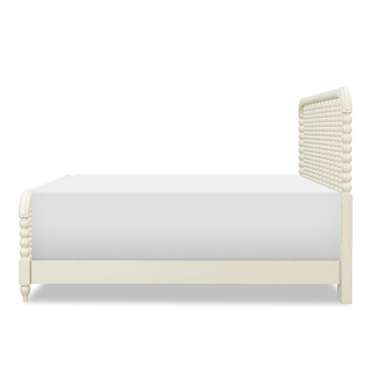 Cream panel bed with beadboard headboard and curved posts, shown from the side.