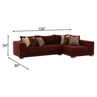 Brown 2-piece sectional sofa with chaise and three decorative pillows; dimensions shown