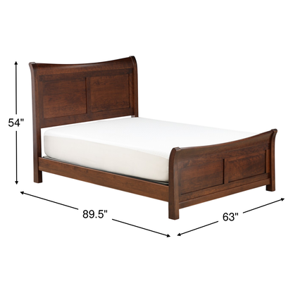 Dark wood sleigh bed with curved headboard, footboard, and white mattress