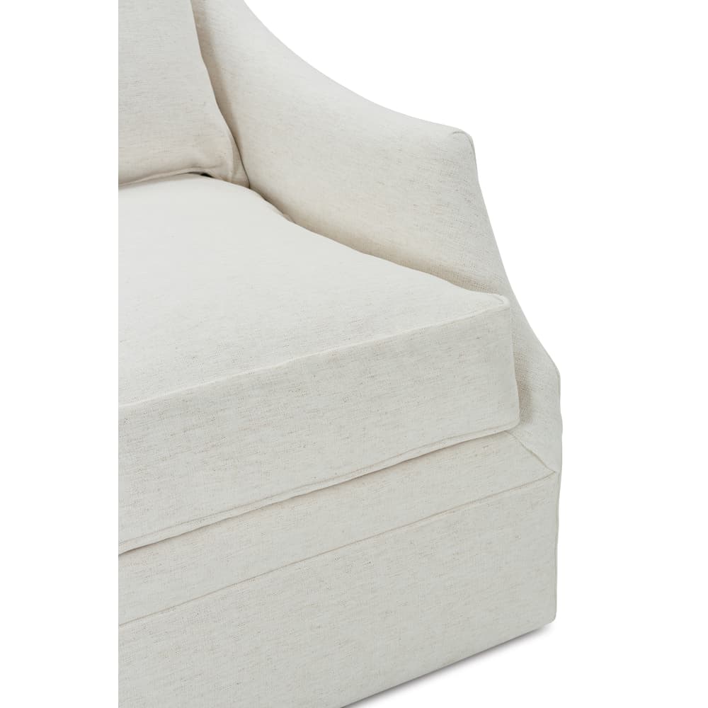 Close view of light beige swivel glider chair arms and seat cushion stitching