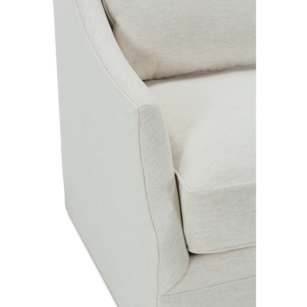 Light beige swivel glider chair close-up of armrest and front panel seam