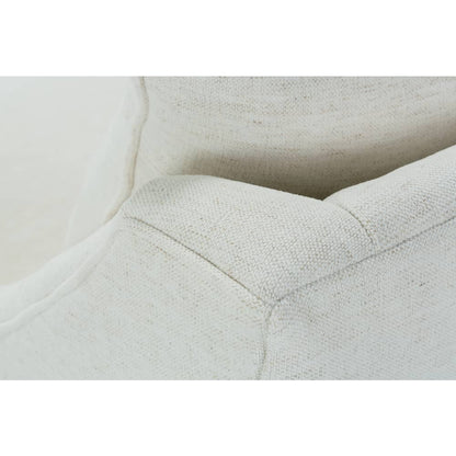 Close-up of light beige swivel glider chair arm seam and cushion stitching