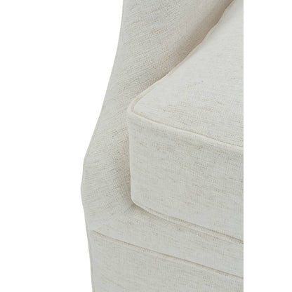 Light beige upholstered glider chair arm and side panel with welt stitching
