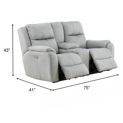 Gray power reclining console loveseat with cushioned armrests and chaise footrest