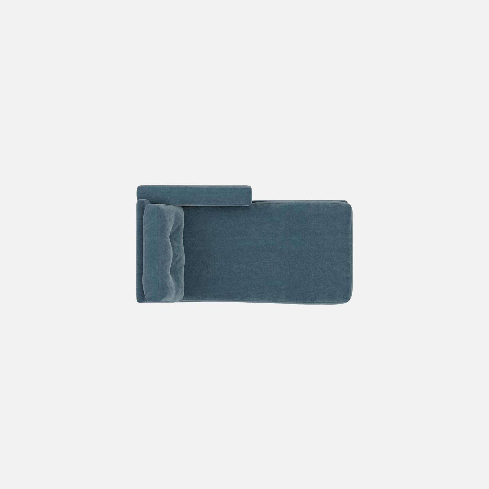 Teal modular chaise lounge with padded backrest and armrest