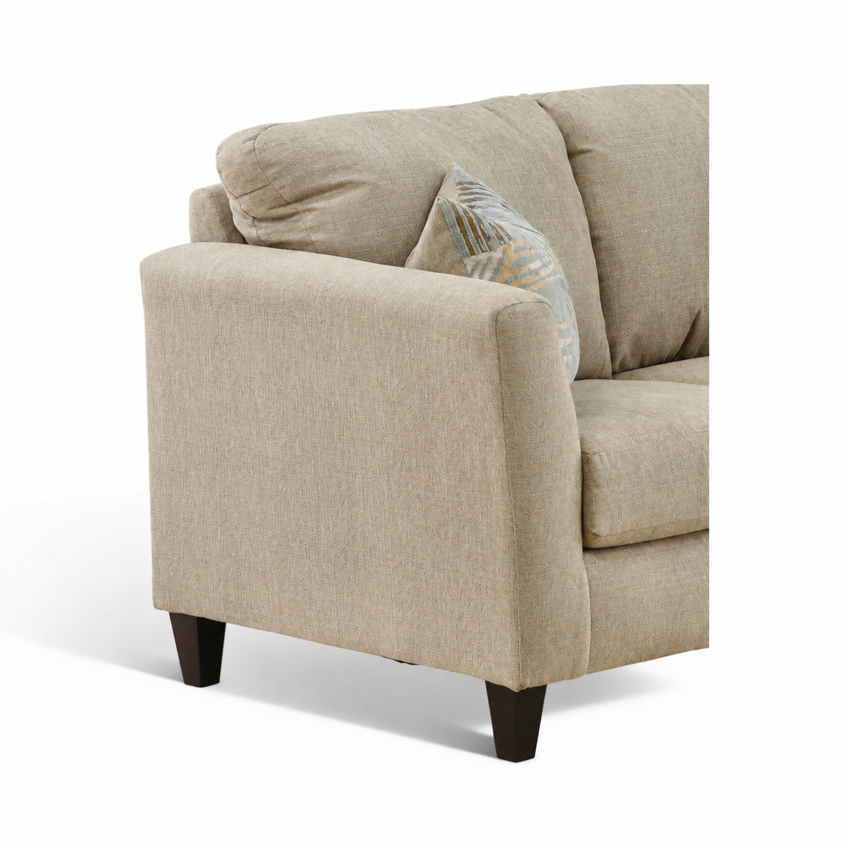 Light beige loveseat corner view with cushioned arm and patterned accent pillow
