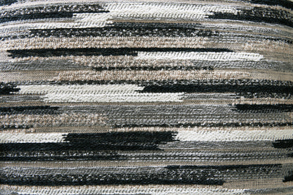 Sectional accent pillow fabric swatch with horizontal black, white and gray stripes.