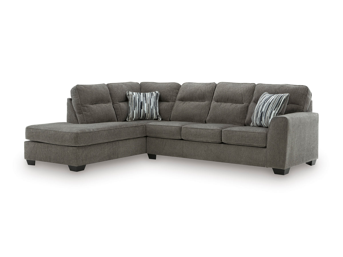 Graphite sectional with left-facing chaise, cushioned back and two striped accent pillows.