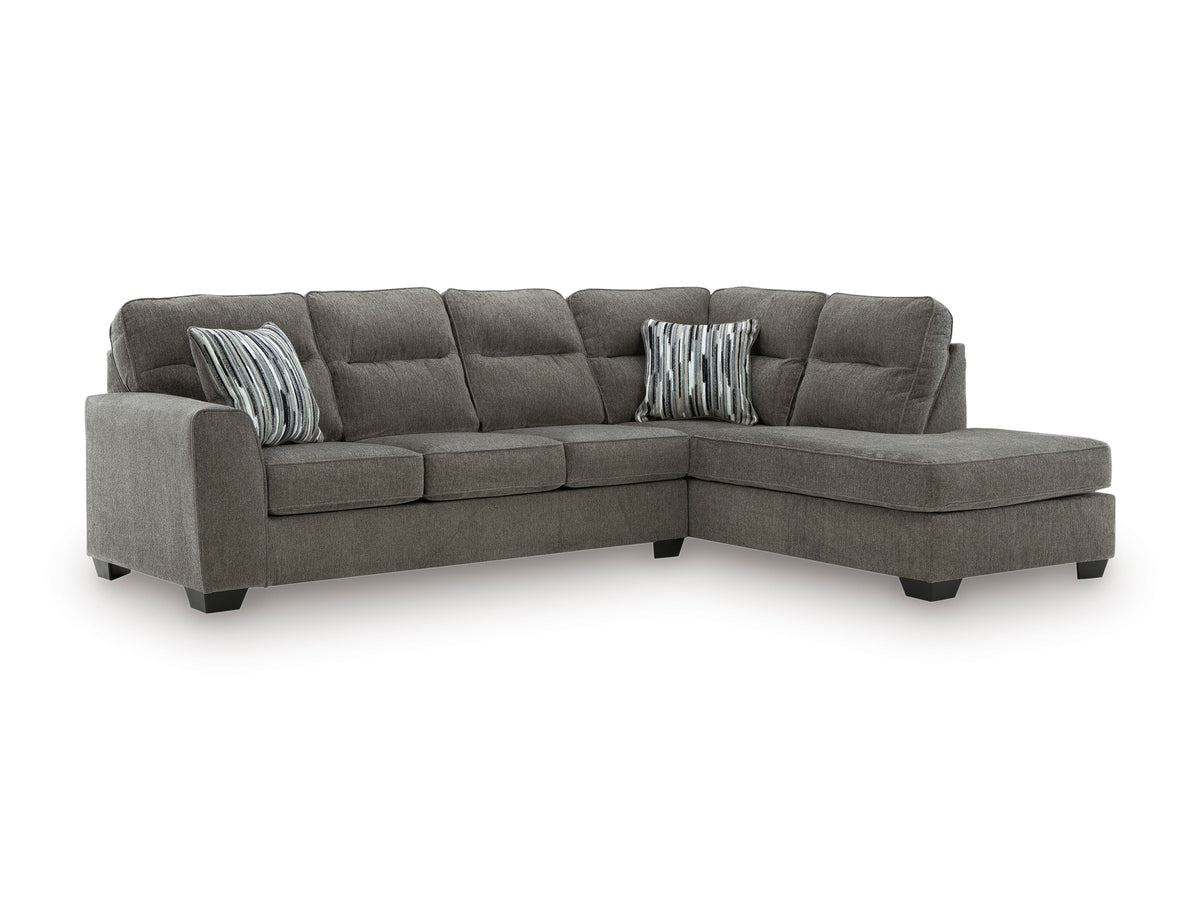 Graphite sectional with right-facing chaise, cushioned back and two striped accent pillows.