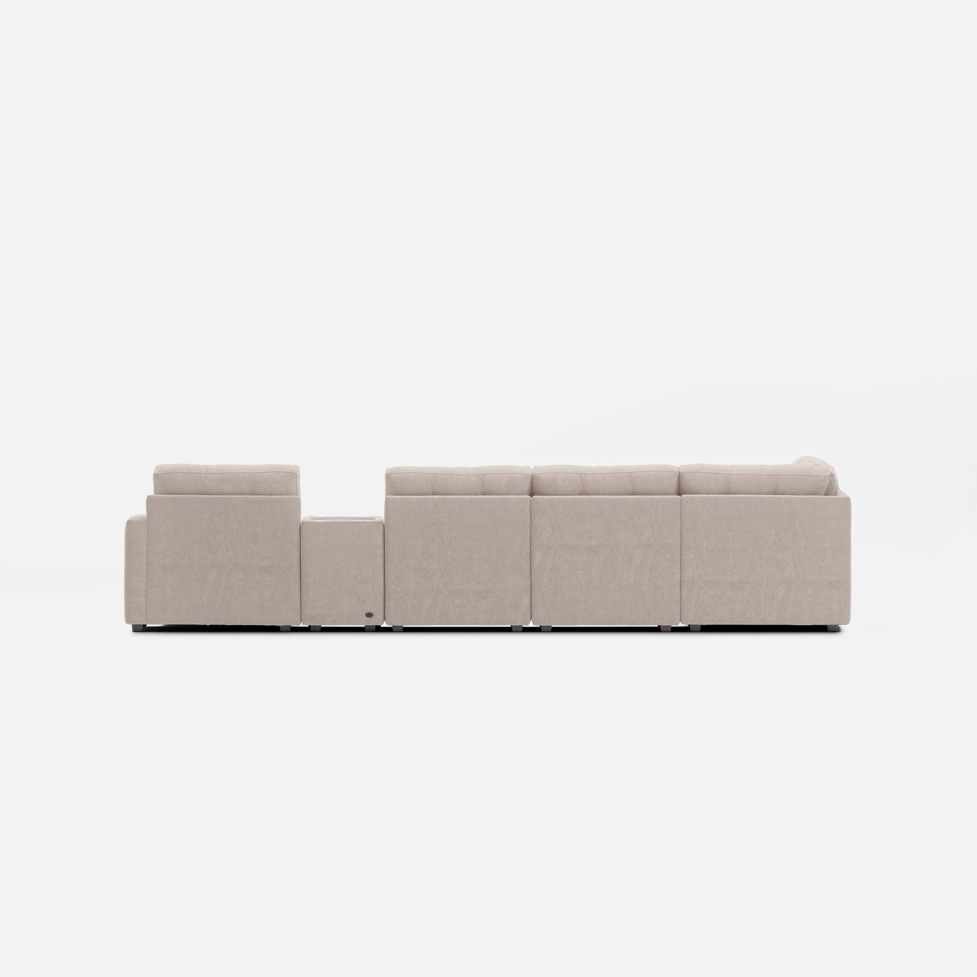 Light beige modular sectional sofa shown from the side with padded back and arms.