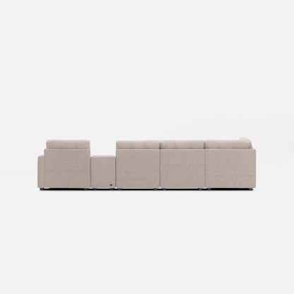 Light beige modular sectional sofa shown from the side with padded back and arms.