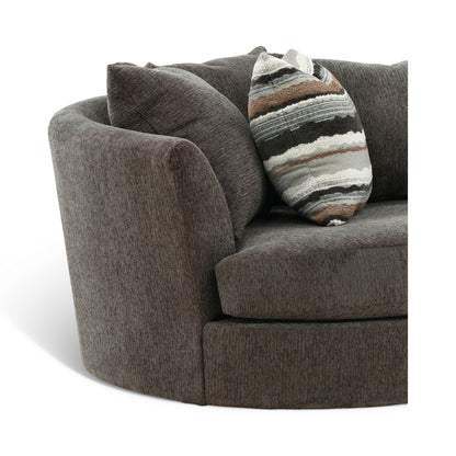Dark gray armchair close-up with curved arms and striped throw pillow