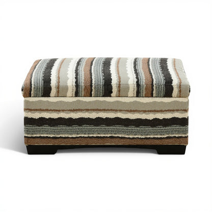 Striped storage ottoman with hinged lift-top and dark wooden legs, beige and charcoal fabric.