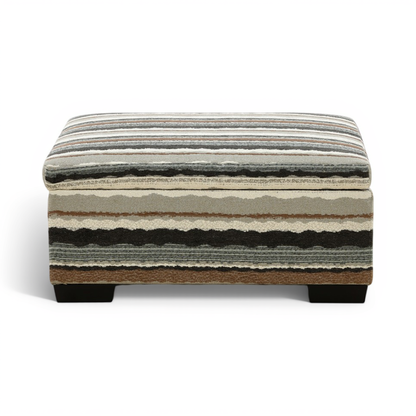 Striped storage ottoman with cushioned top, dark legs, and multicolor horizontal bands.