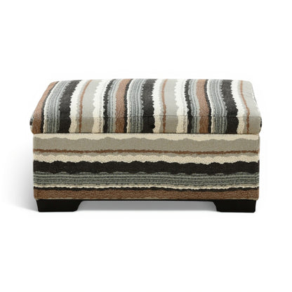 Striped storage ottoman with cushioned top and dark legs, beige, charcoal, and gray fabric.