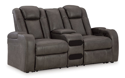 Dark gray dual power reclining loveseat with console, reclined seat positions