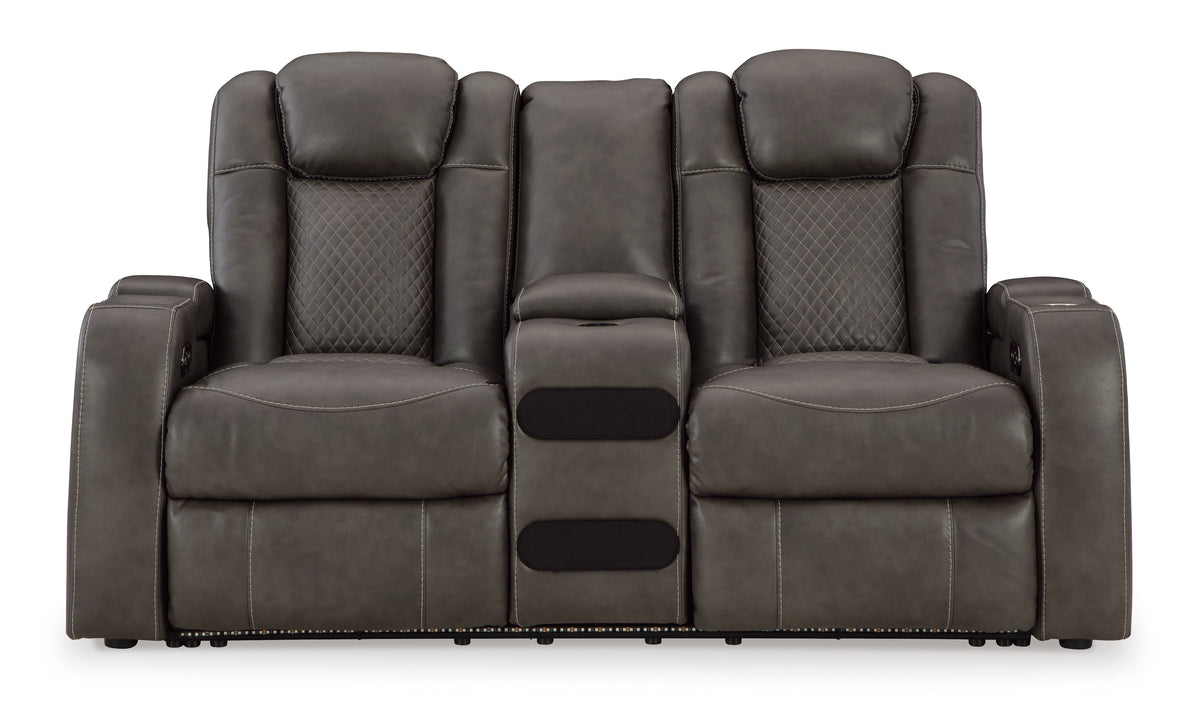 Dark gray dual power reclining loveseat with center console and padded armrests