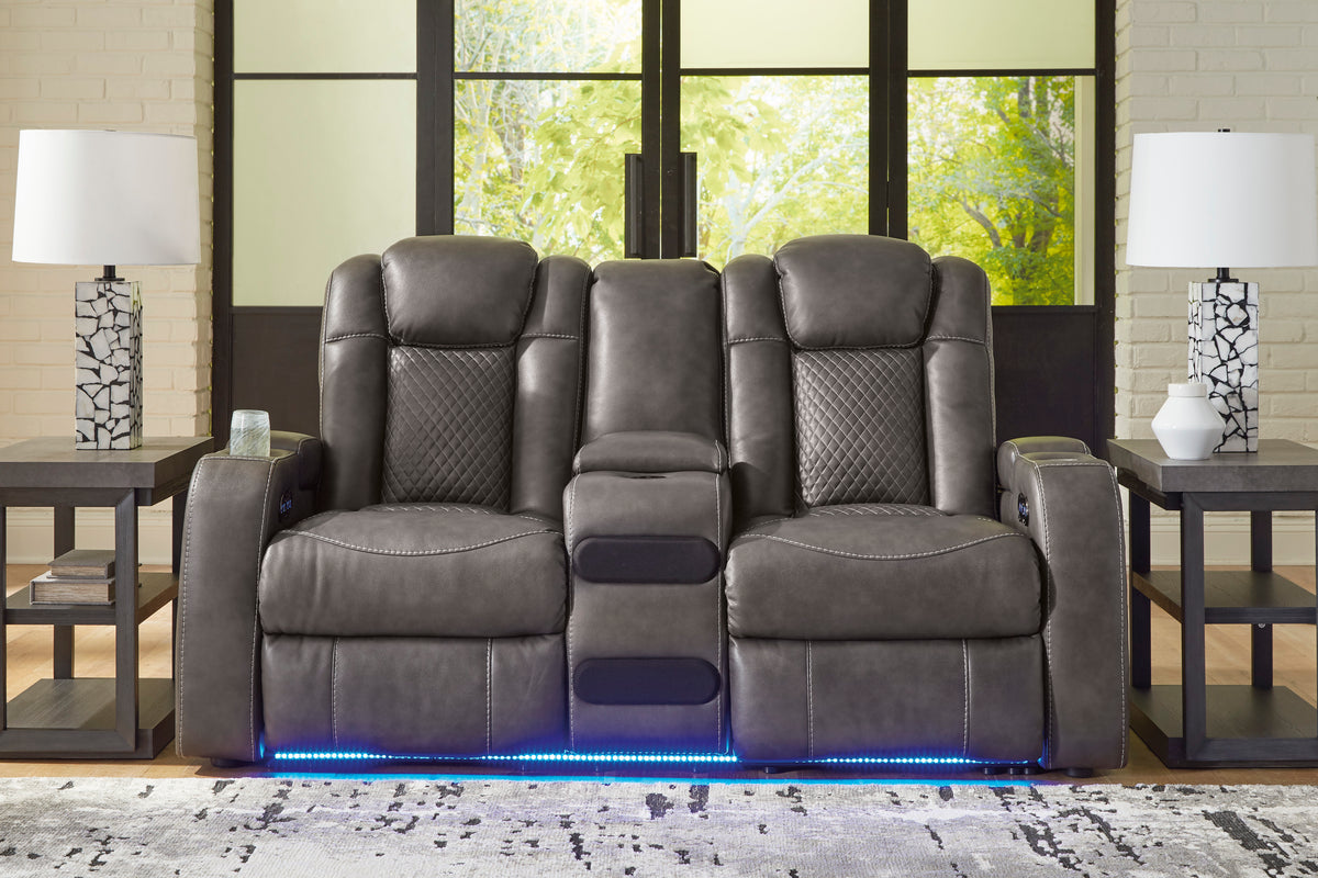 Dark gray dual power reclining loveseat with center console and blue LED base strip