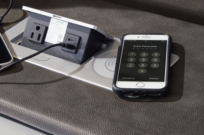 Power reclining loveseat console with power outlets and touch control on dark upholstery