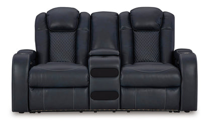 Dark power reclining loveseat with console and cushioned headrests, front view
