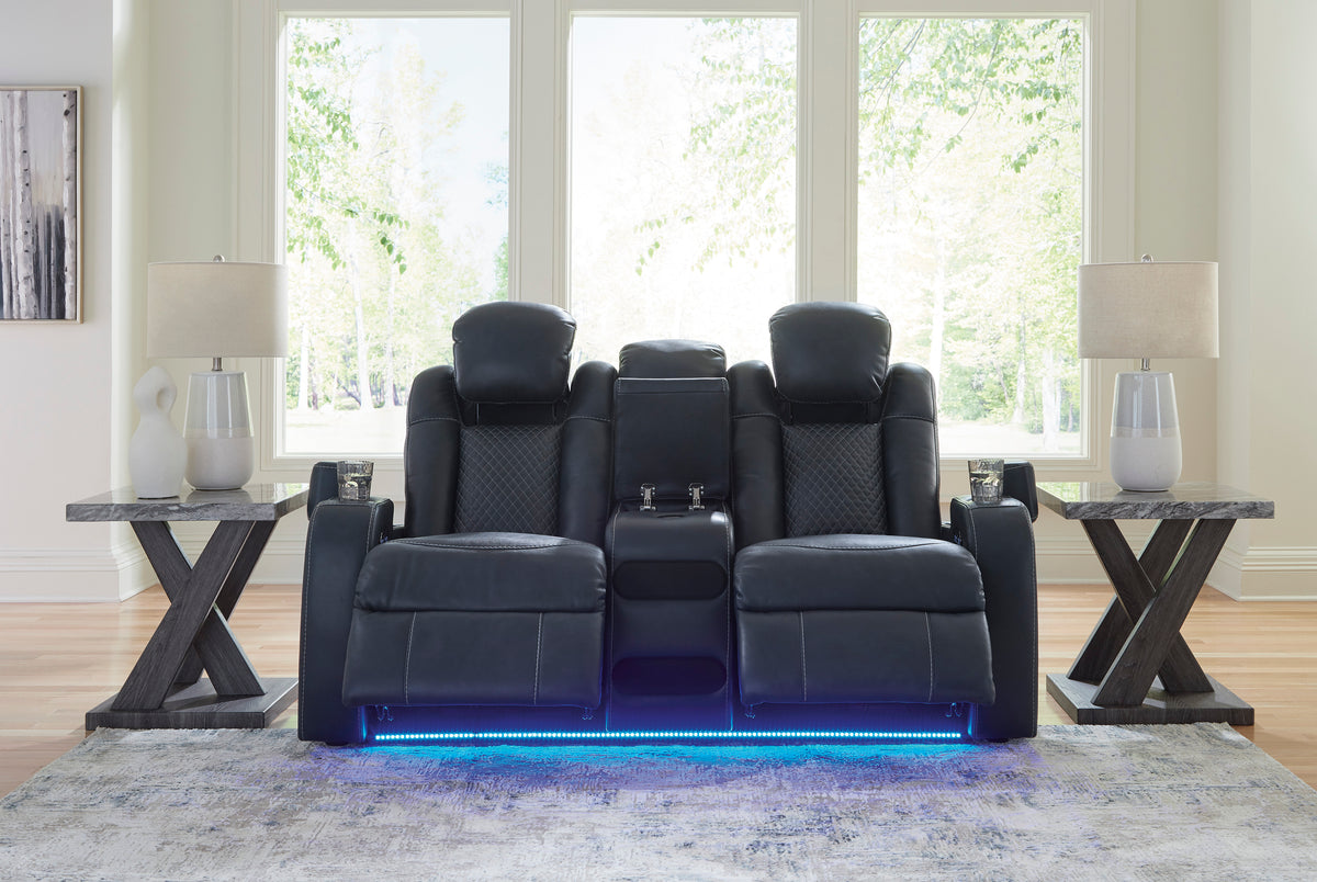 Dark power reclining loveseat with console and blue LED strip at the base, front view