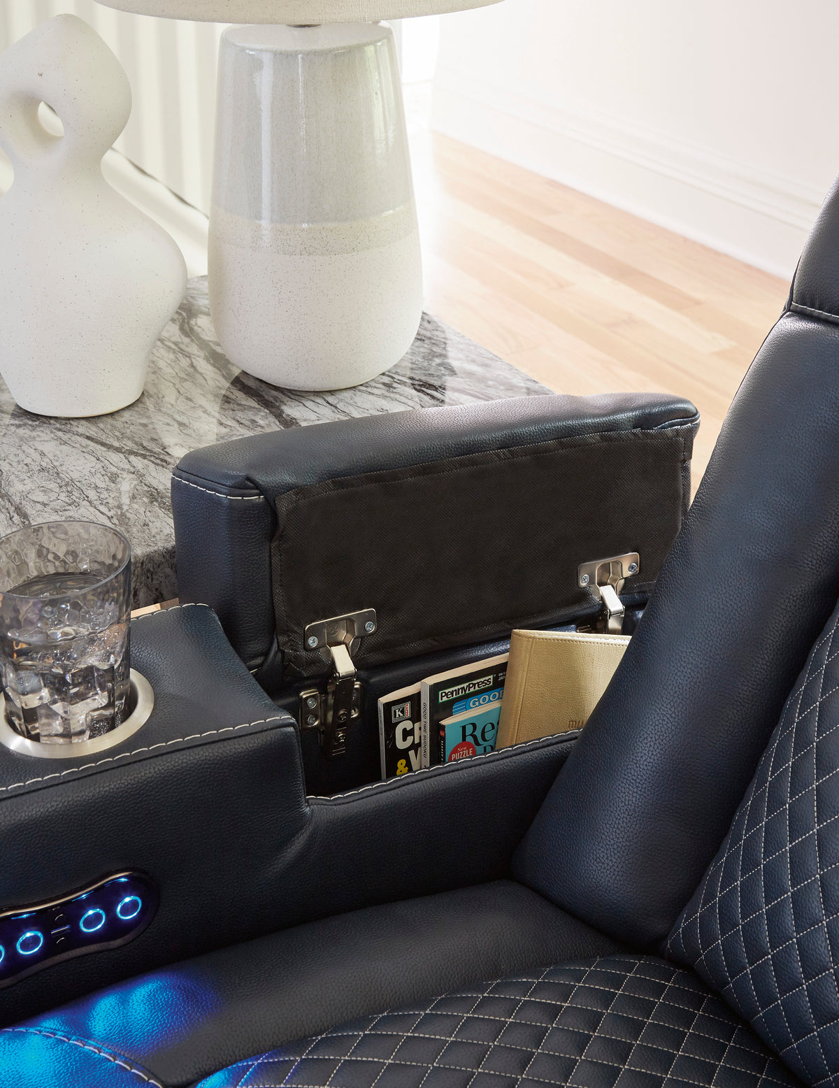 Black console storage with open compartments and cup holders