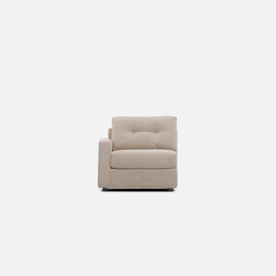 Light beige upholstered modular chair with square arms and tufted back cushion