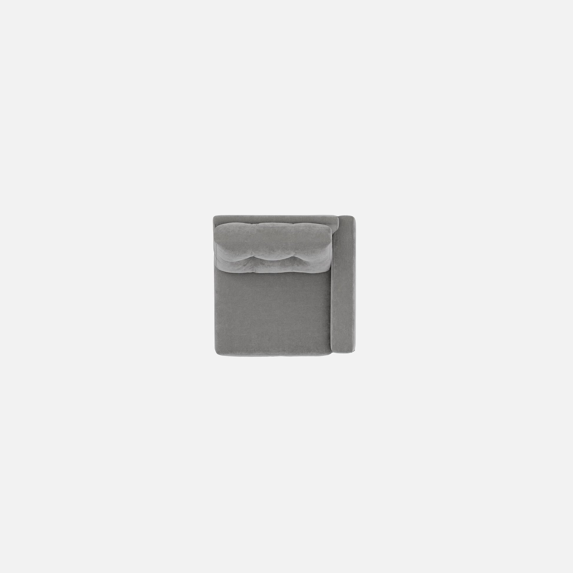 Gray upholstered modular chair with tufted back and compact square silhouette