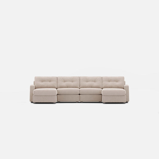 Stone sectional sofa with two chaise lounges, padded arms, and tufted back cushions
