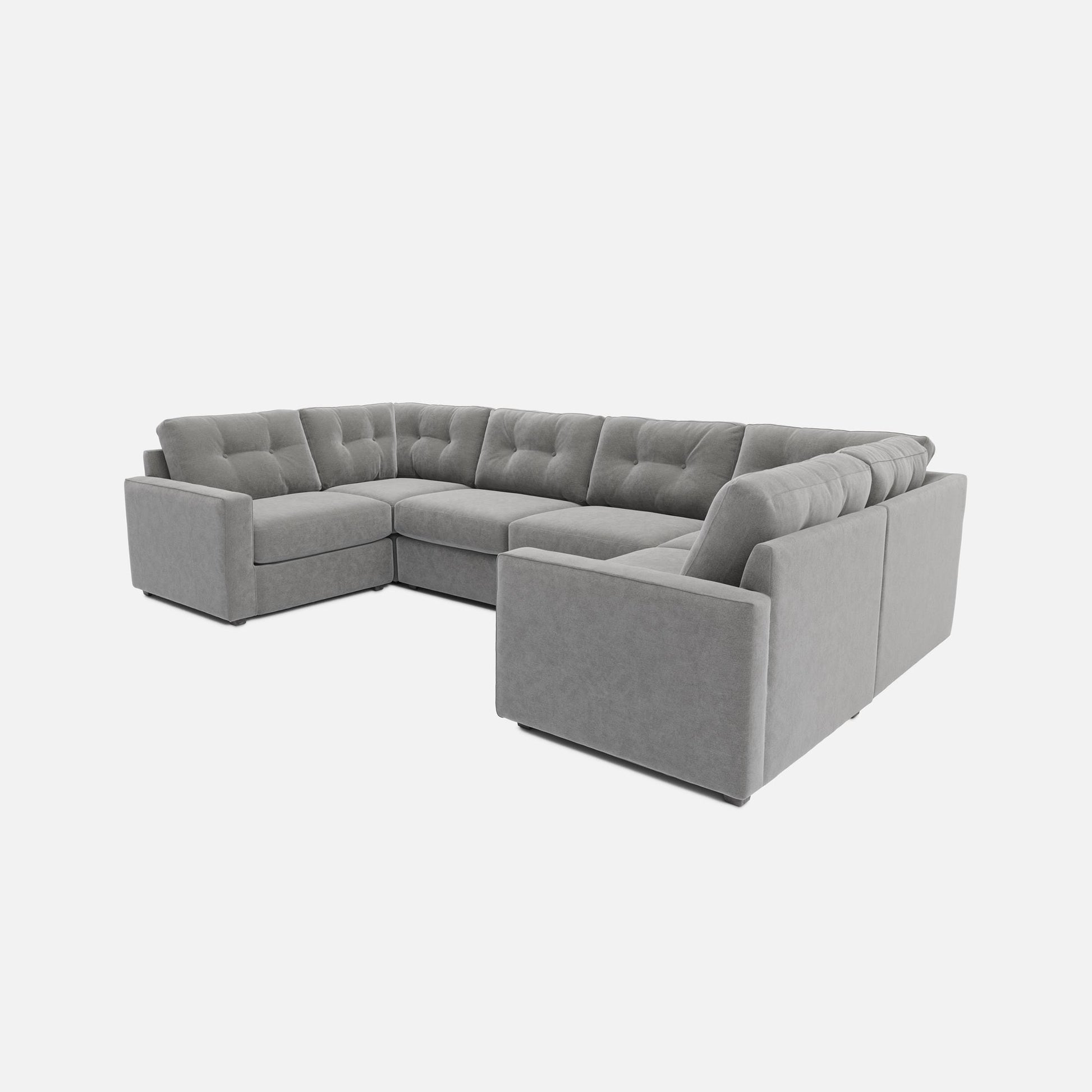 Light gray 6-piece modular sectional sofa with chaise-style corner and thick arms