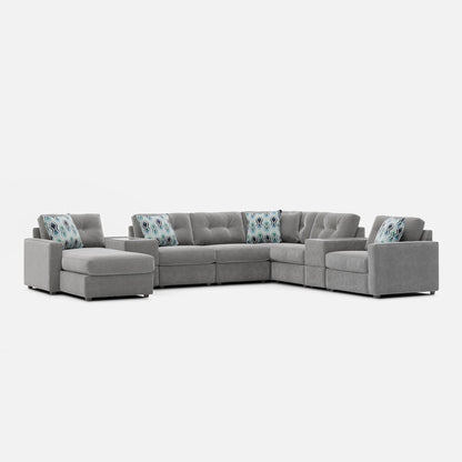 Light gray modular sectional sofa with patterned accent pillows on backrest