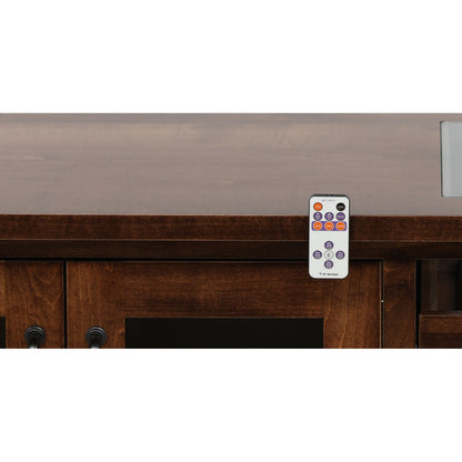 Wooden cabinet front with gray top and RF wireless remote resting near the opening
