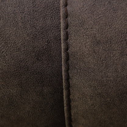 Wall-hugging power recliner side seam close-up with dark brown faux leather stitching