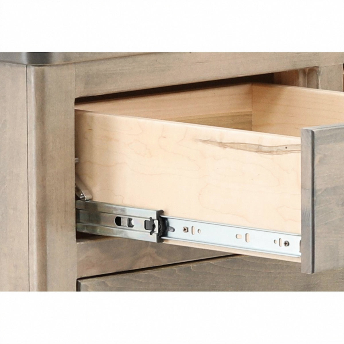 Artisan dresser close-up of open drawer interior with full-extension slide mechanism