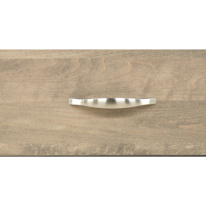 Curved metal drawer handle centered on light wood nightstand front