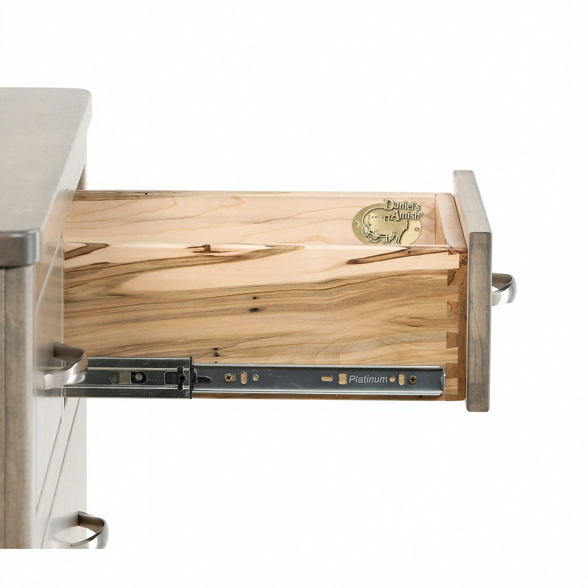Chest of drawers top interior view with slide rails, light wood panel, and metal latch